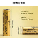 Vapcell G50 21700 batteries lined up next to fish paper insulators and pure nickel strip for pack assembly.