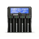 XTAR DRAGON VP4L Plus 4-slot pro battery charger and tester with internal resistance test probes, LCD display, and 12V power adapter for Li-ion, IMR, NiMH and NiCd batteries.